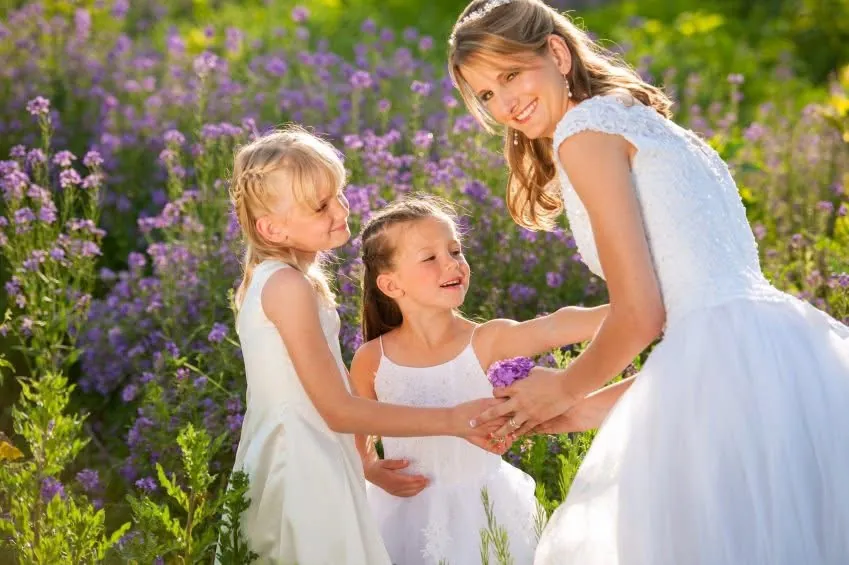 Girls in dresses standing in a flower garden